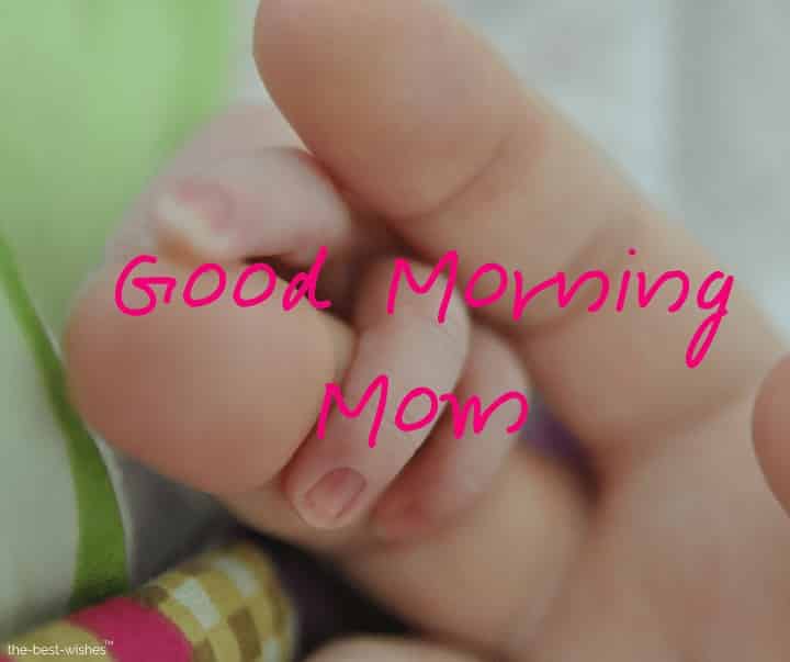 good morning mom baby holding finger